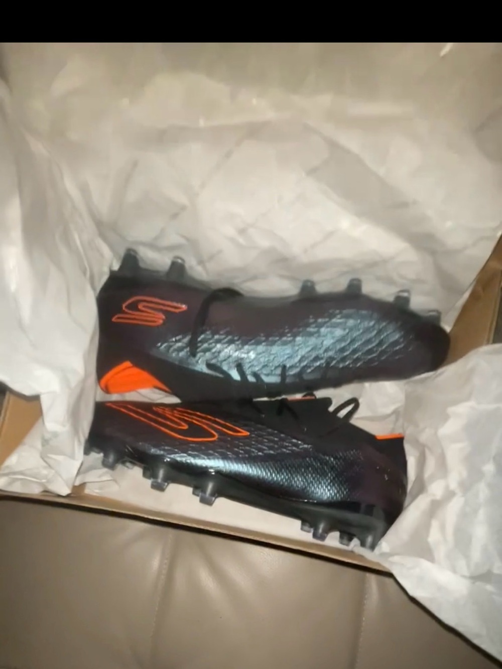 Skechers Black Football Cleats with Orange Accents